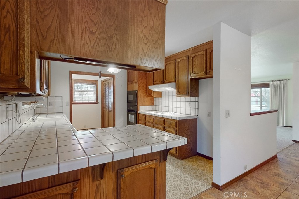 510 Indiana Street Gridley, CA 95948 - Photo 16 of 45 a kitchen with kitchen island sink stove and refrigerator