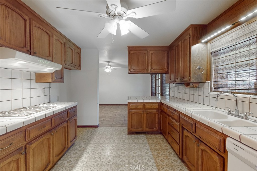 510 Indiana Street Gridley, CA 95948 - Photo 17 of 45 a kitchen with stainless steel appliances granite countertop a sink and a stove