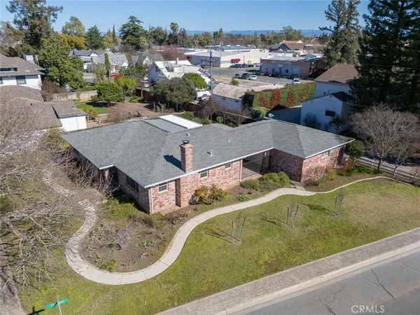 an aerial view of a house with yard swimming pool and outdoor seating