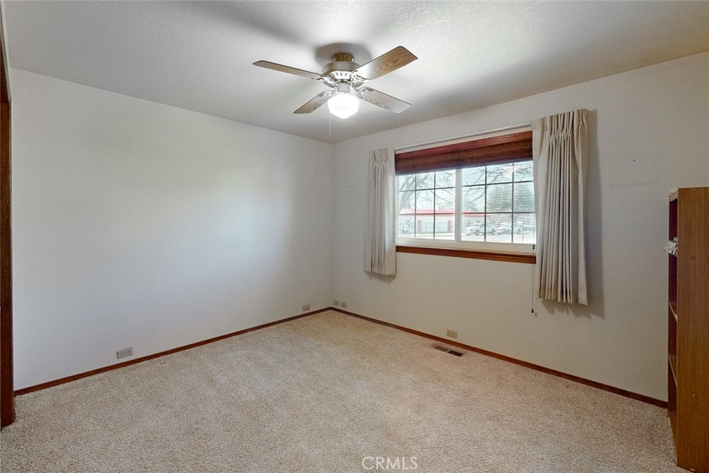 510 Indiana Street Gridley, CA 95948 - Photo 23 of 45 an empty room with windows and fan