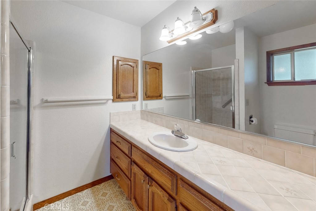 510 Indiana Street Gridley, CA 95948 - Photo 28 of 45 a bathroom with a sink and a mirror