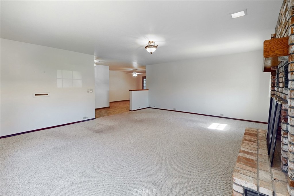 510 Indiana Street Gridley, CA 95948 - Photo 9 of 45 an empty room with a projector and cabinets