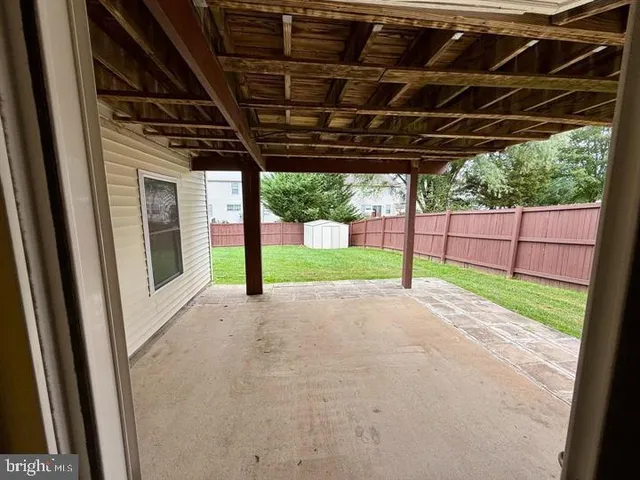 a view of porch with green space