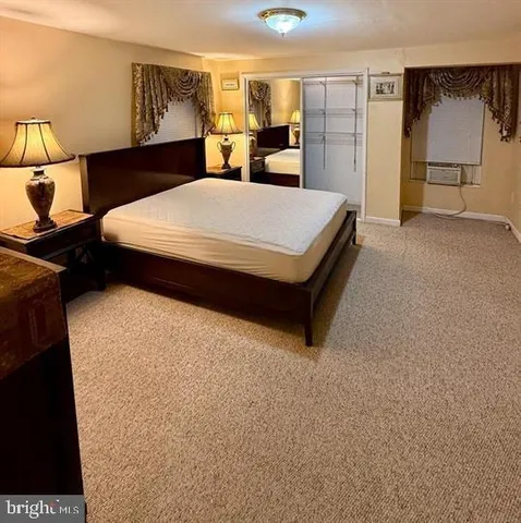 a bed room with a bed and a night stand