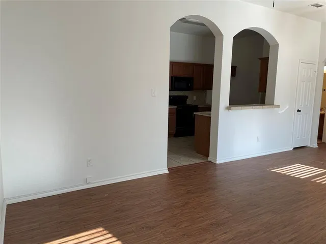 a view of a livingroom with wooden floor