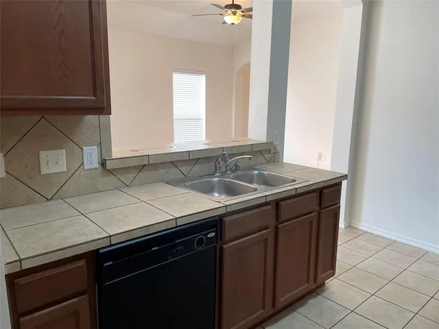 a sink with a sink and cabinets