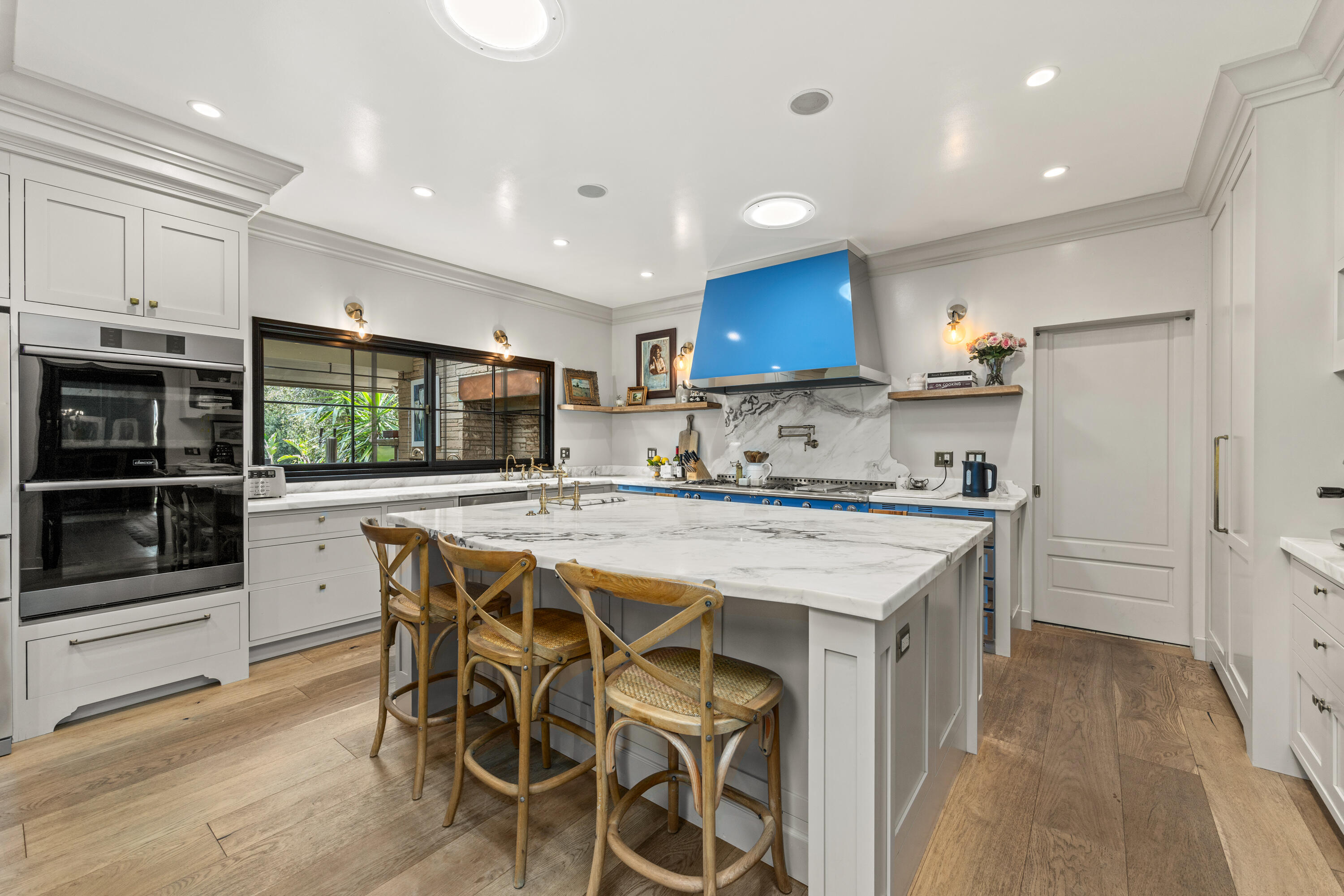 785 Carosam Road Santa Barbara, CA 93110 - Photo 14 of 46 a kitchen with stainless steel appliances kitchen island granite countertop a stove a sink a microwave and a refrigerator