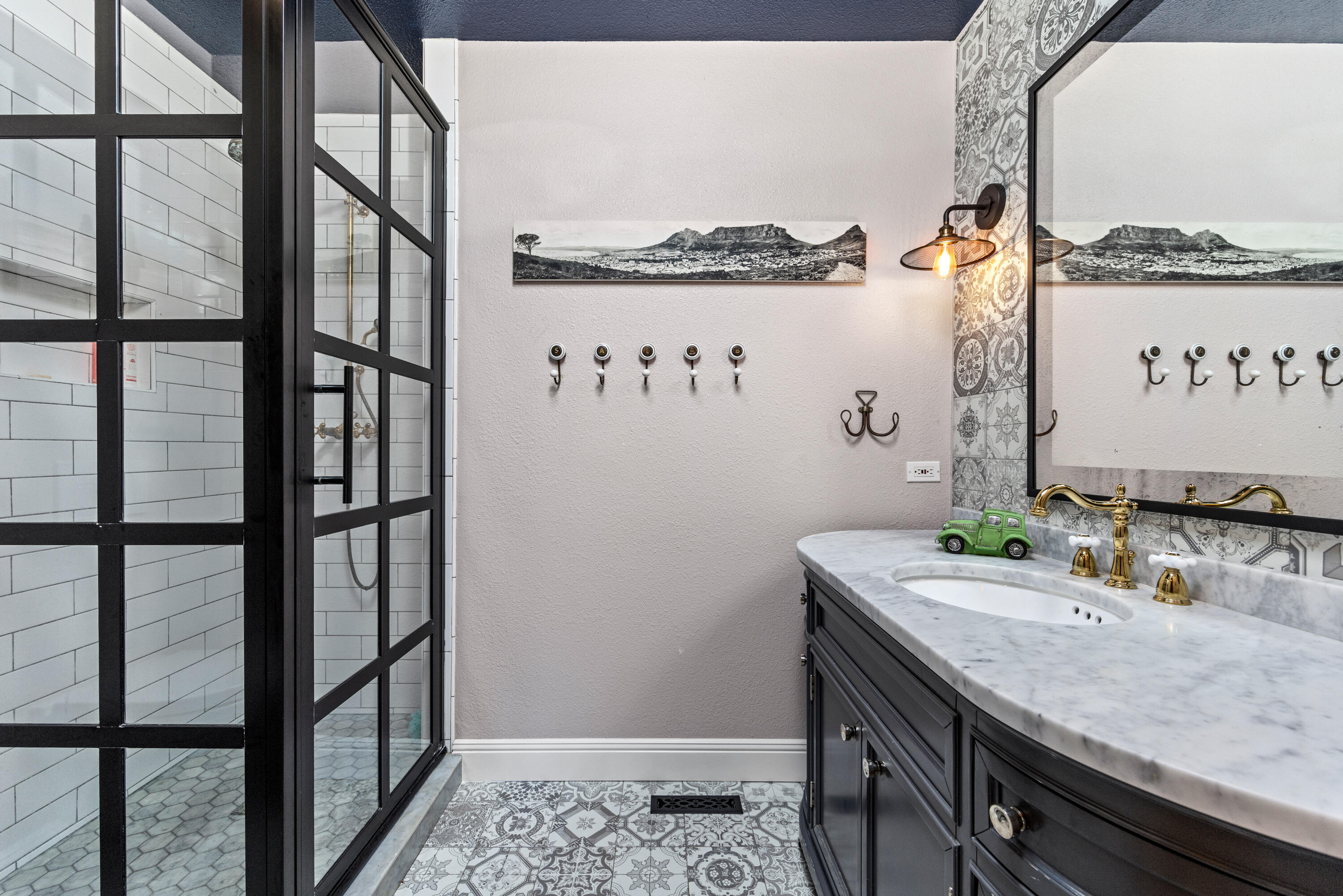 785 Carosam Road Santa Barbara, CA 93110 - Photo 29 of 46 a bathroom with a granite countertop sink and a mirror