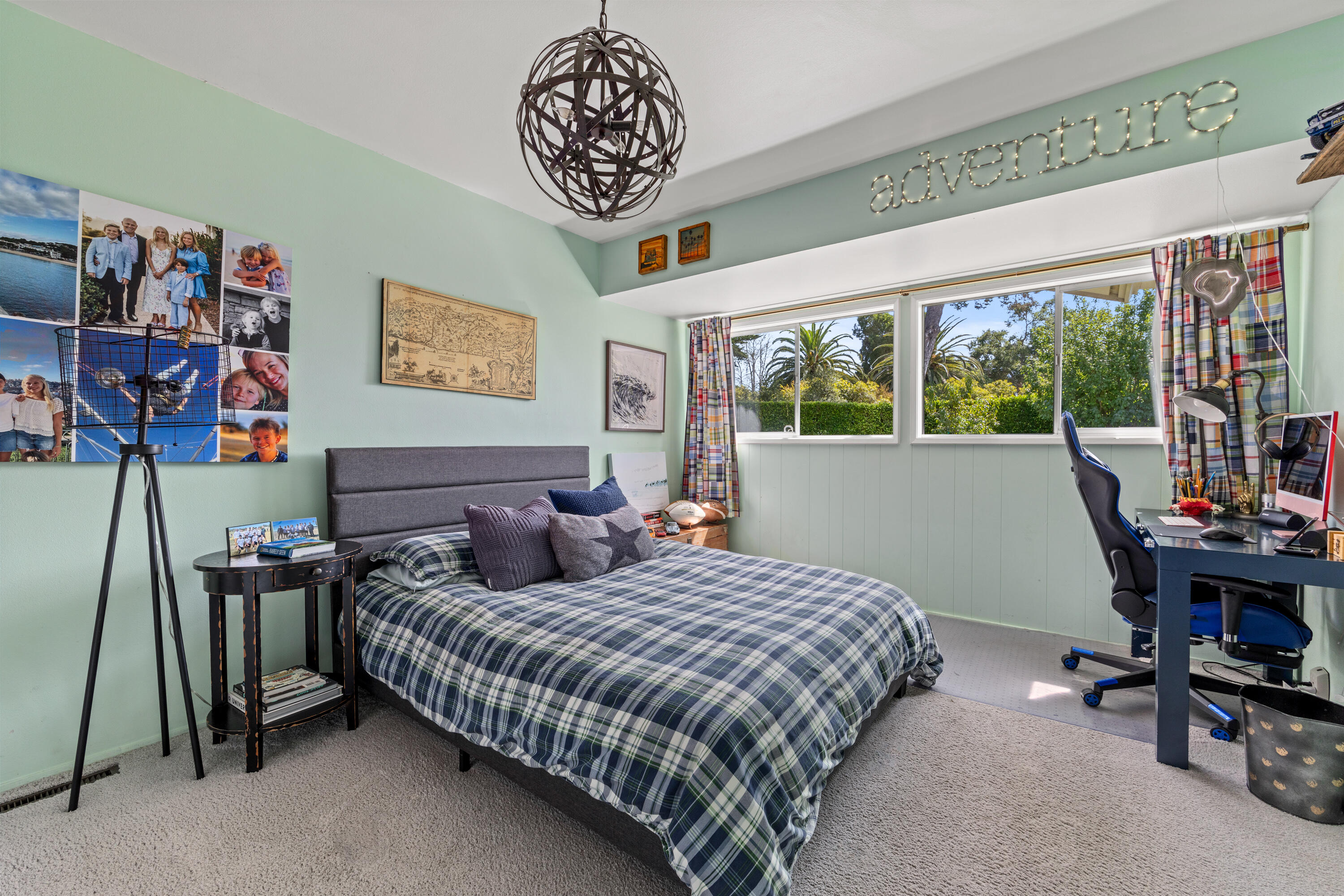 785 Carosam Road Santa Barbara, CA 93110 - Photo 30 of 46 a bedroom with a bed and a chandelier