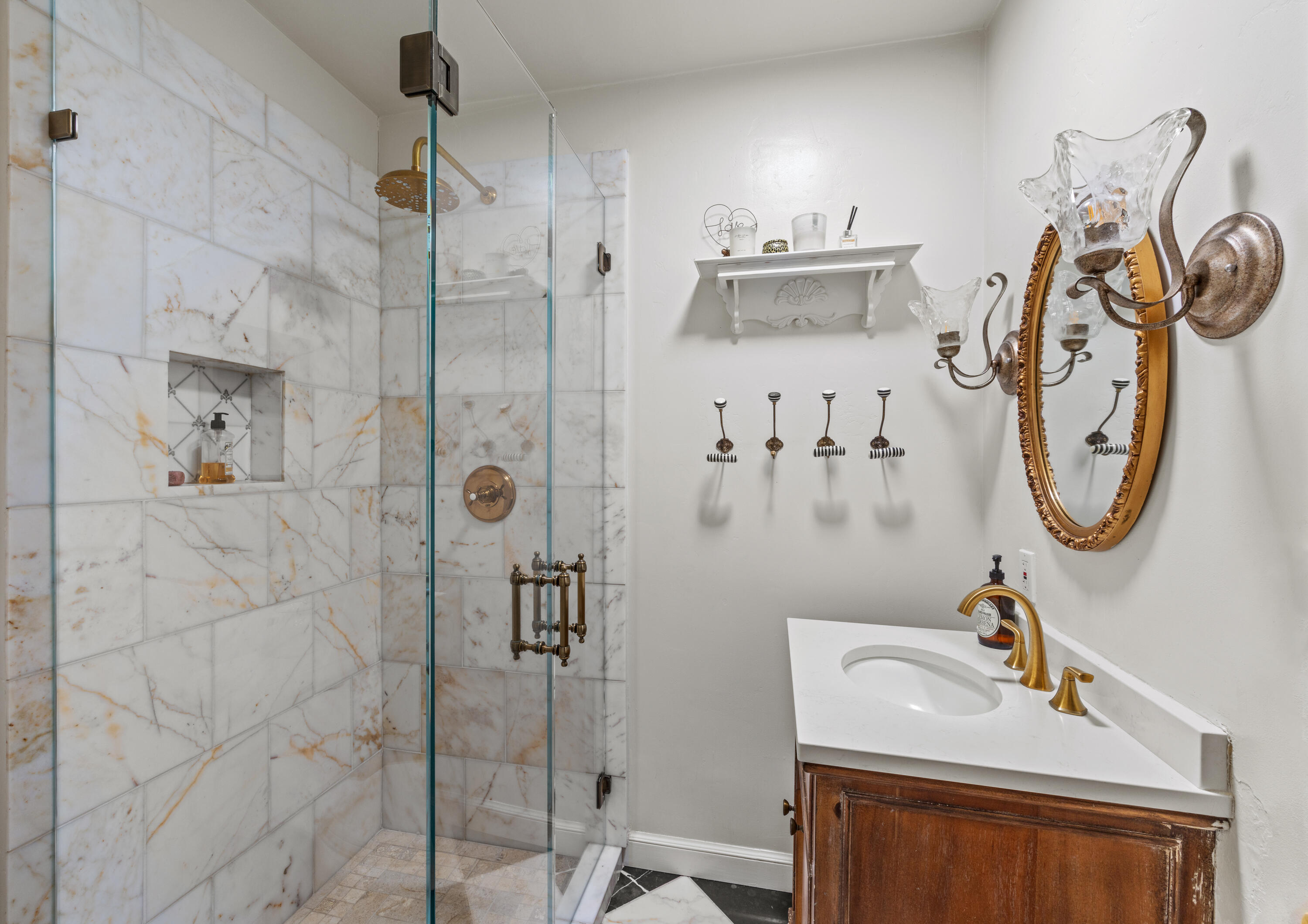 785 Carosam Road Santa Barbara, CA 93110 - Photo 34 of 46 a bathroom with a sink a mirror and shower