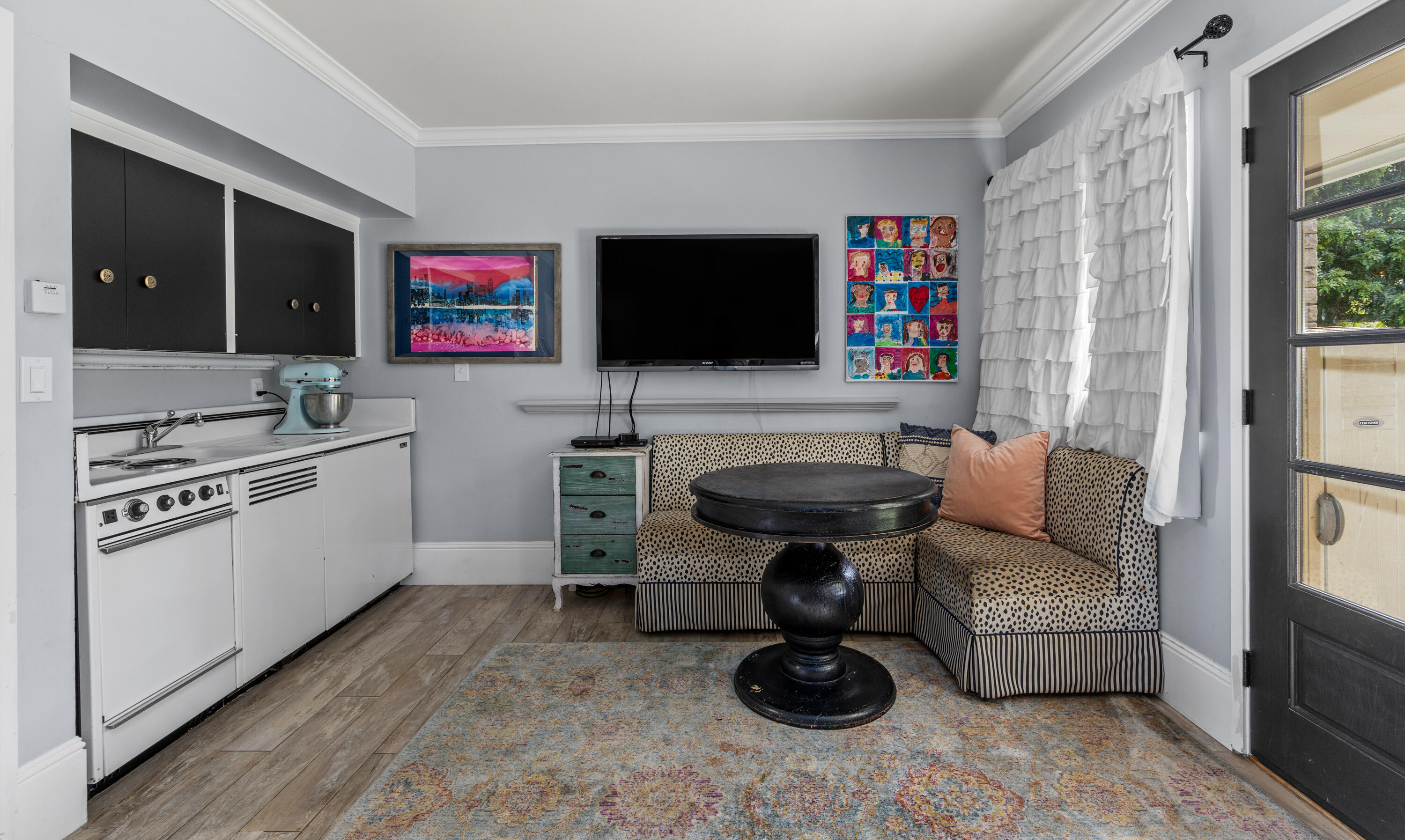 785 Carosam Road Santa Barbara, CA 93110 - Photo 36 of 46 a living room with furniture and a flat screen tv