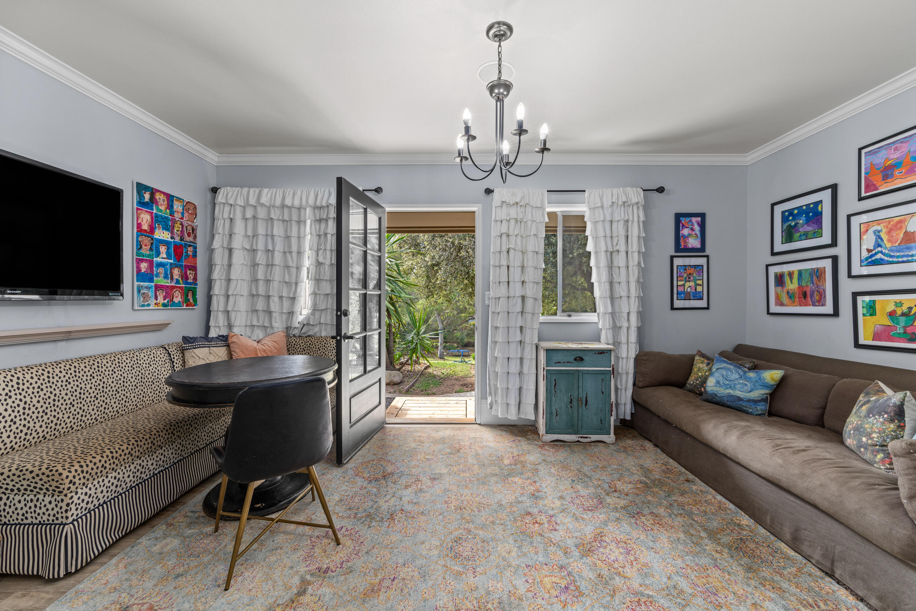 785 Carosam Road Santa Barbara, CA 93110 - Photo 37 of 46 a living room with furniture and a flat screen tv