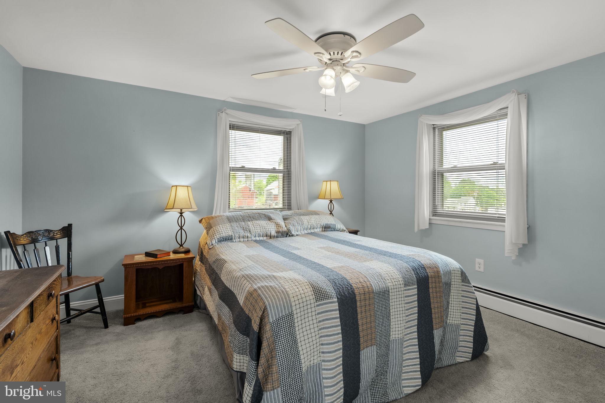 1160 Narvon Road Narvon, PA 17555 - Photo 41 of 64 a bedroom with a bed and a chandelier