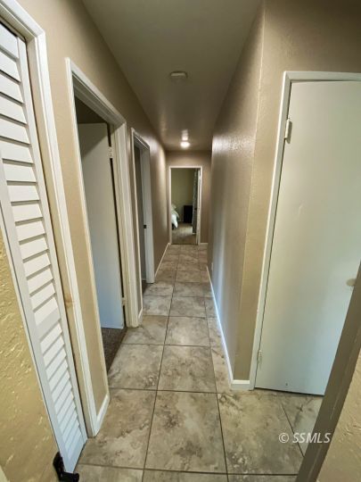 205 Kimberly Lane Ridgecrest, CA 93555 - Photo 15 of 39 a view of a hallway