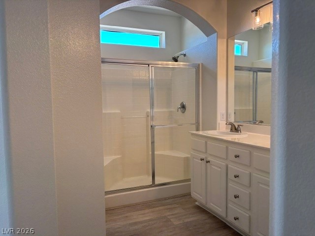 2866 Shimmering Bay Street Laughlin, NV 89029 - Photo 18 of 32 A streamlined bathroom offers a glass-enclosed shower alongside a pristine vanity with a large mirror.