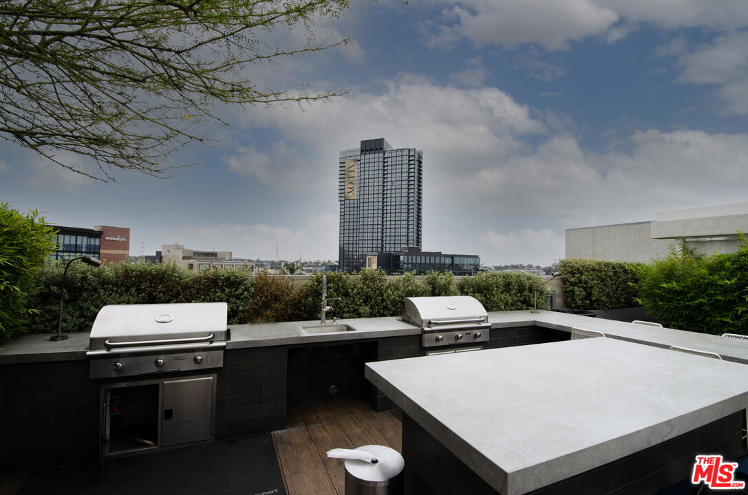 527 Molino Street, Unit 217 Los Angeles, CA 90013 - Photo 16 of 28 a terrace of a house with outdoor seating
