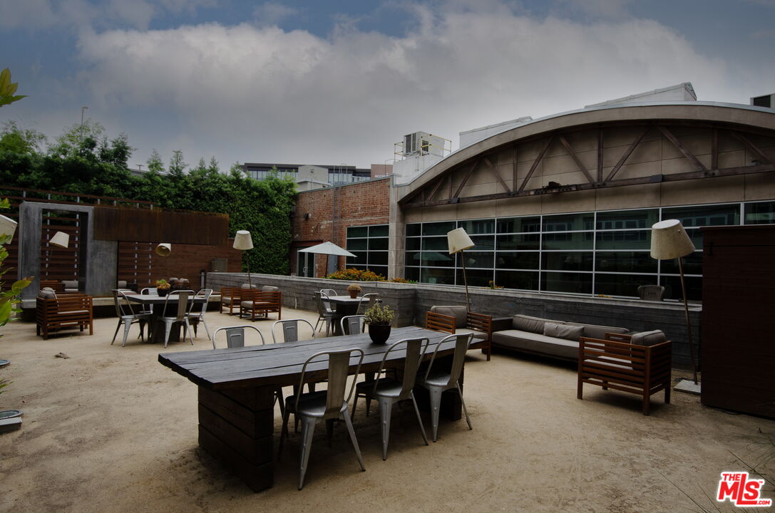 527 Molino Street, Unit 217 Los Angeles, CA 90013 - Photo 19 of 28 a view of house with deck and outdoor seating