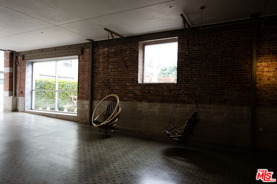 527 Molino Street, Unit 217 Los Angeles, CA 90013 - Photo 24 of 28 a view of a room with gym equipment and a window