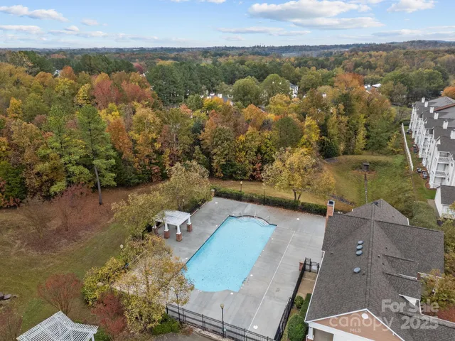 an aerial view of a house with a lake view