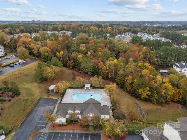 an aerial view of a house with a lake view