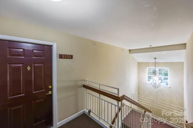 a view of a hallway with a window