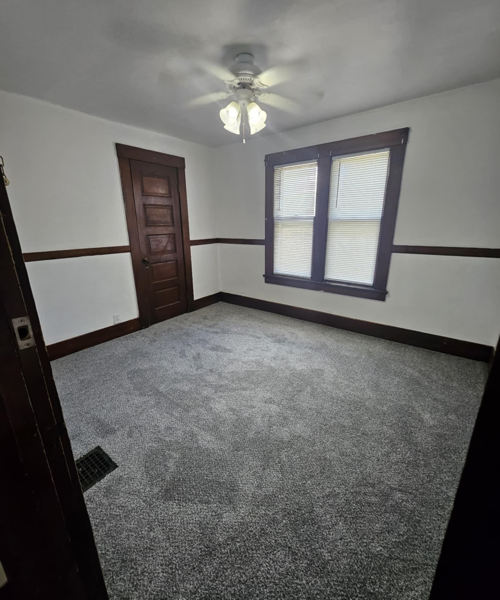 1219 Hackett Street Beloit, WI 53511 - Photo 10 of 19 wooden floor in an empty room with a window