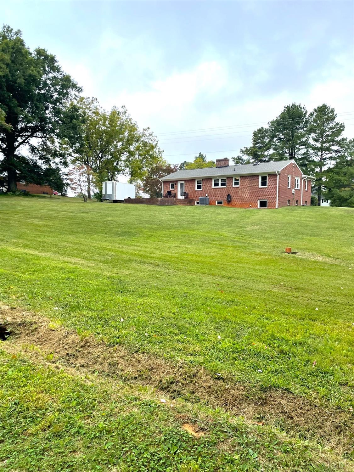 8968 Red House Road Appomattox, VA 24522 - Photo 3 of 31 a view of a big yard with large trees