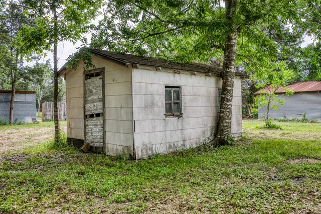 a backyard of a house with lots of green space