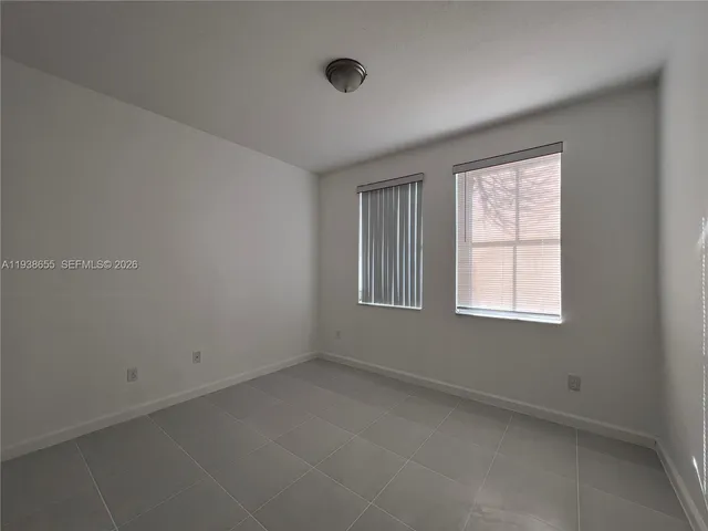 a bathroom with a toilet a sink a mirror a bathtub and vanity