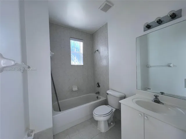 a view of a hallway with washer and dryer