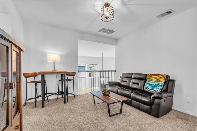 a living room with furniture and a table
