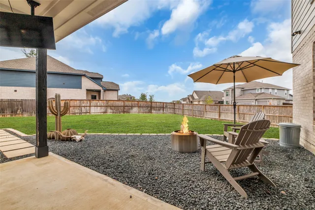 a view of a sitting area with furniture and backyard