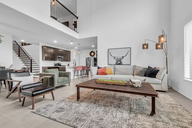 a living room with furniture and a rug