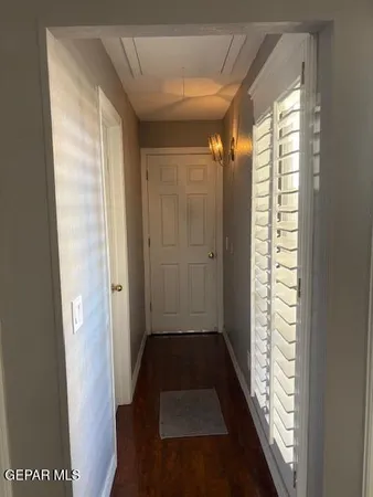 a bathroom with a shower and a window