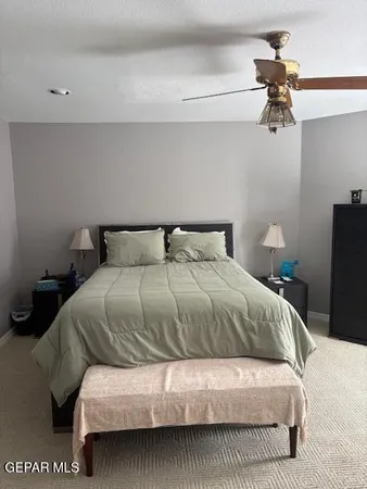 a living room with a bed furniture and a window