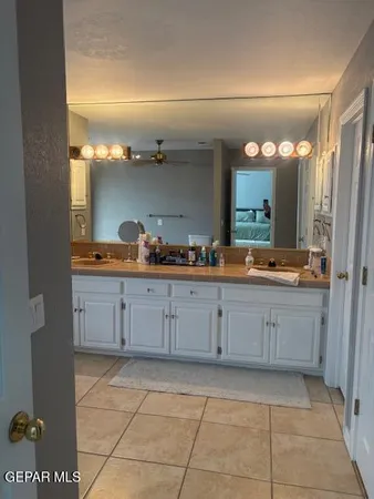 a bathroom with a mirror and a sink