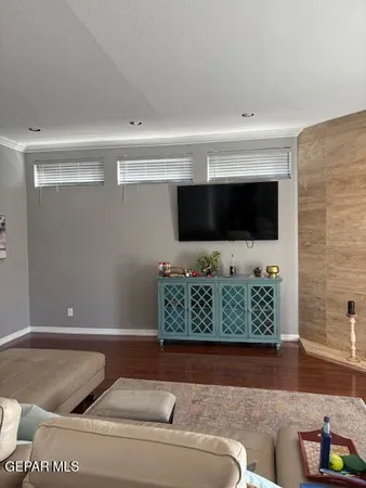 a living room with a couch and a rug