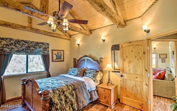 a kitchen with wooden cabinets and a wooden floor