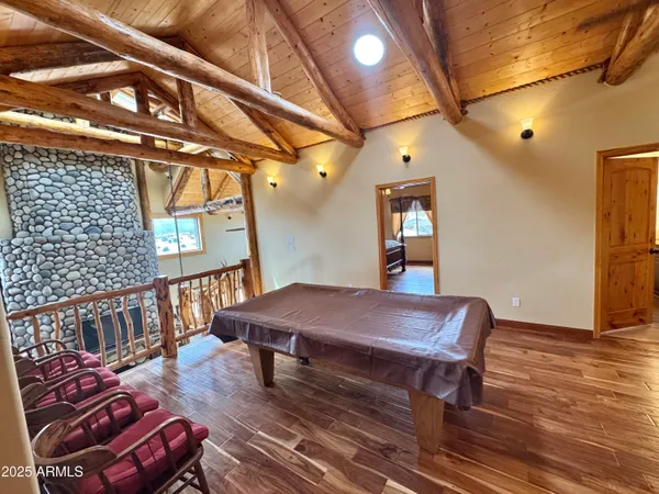 a living room with lots of furniture and a gym machine