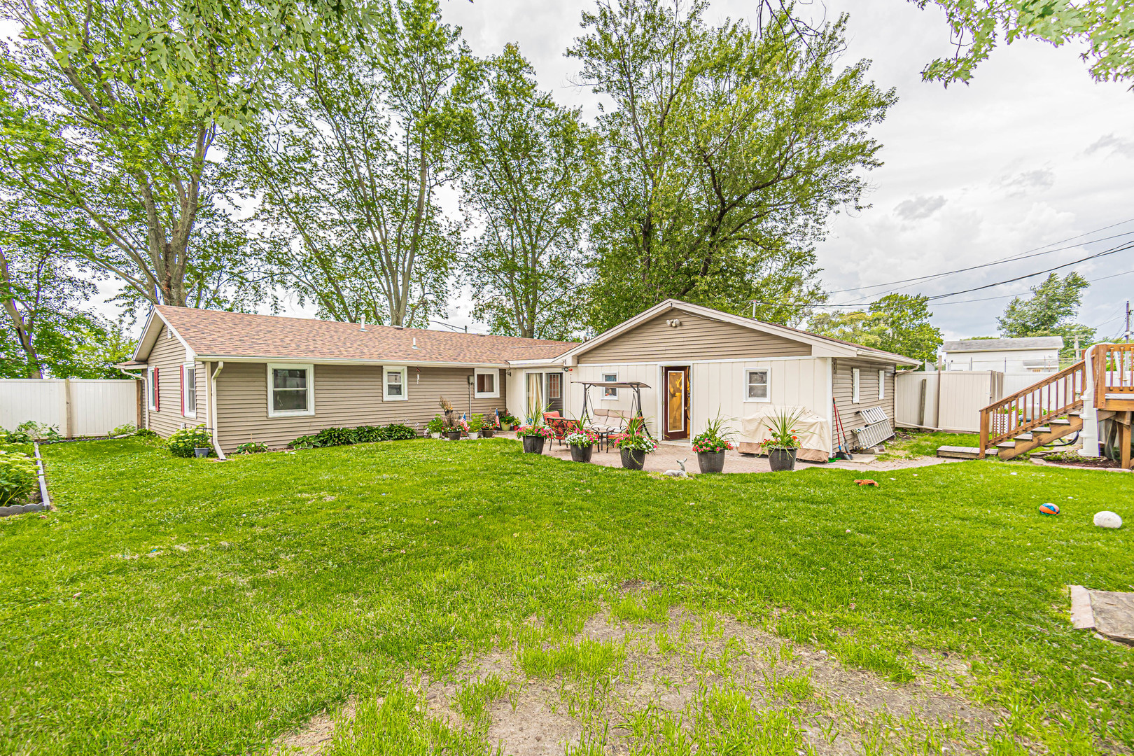 19264 Airport Road Romeoville, IL 60446 - Photo 19 of 27 a view of a house with a yard and deck