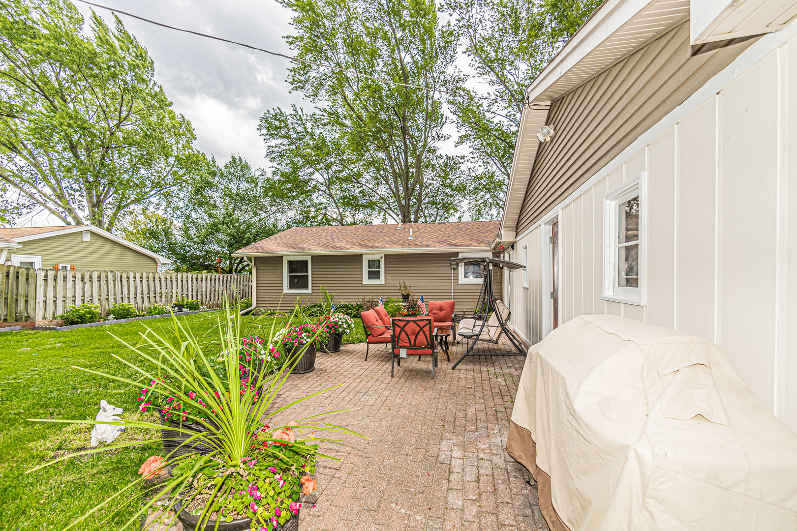 19264 Airport Road Romeoville, IL 60446 - Photo 23 of 27 a view of a house with backyard sitting area and garden