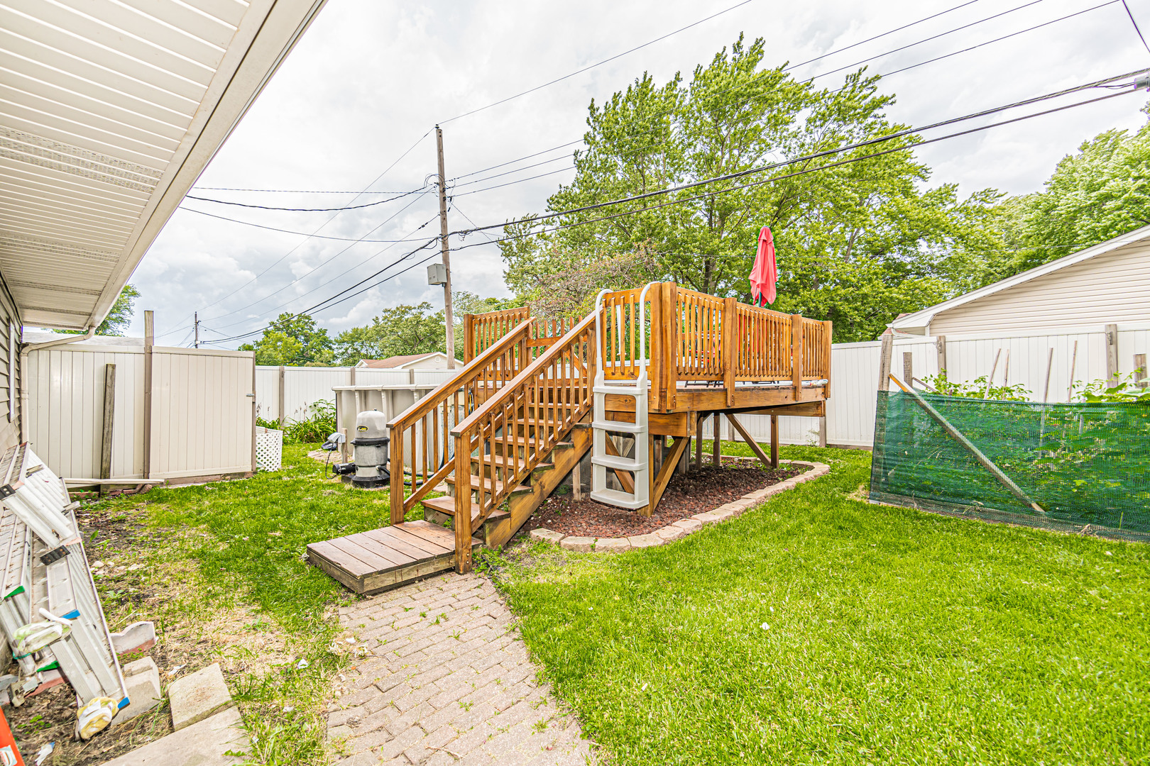 19264 Airport Road Romeoville, IL 60446 - Photo 24 of 27 a view of a chair and table in the backyard