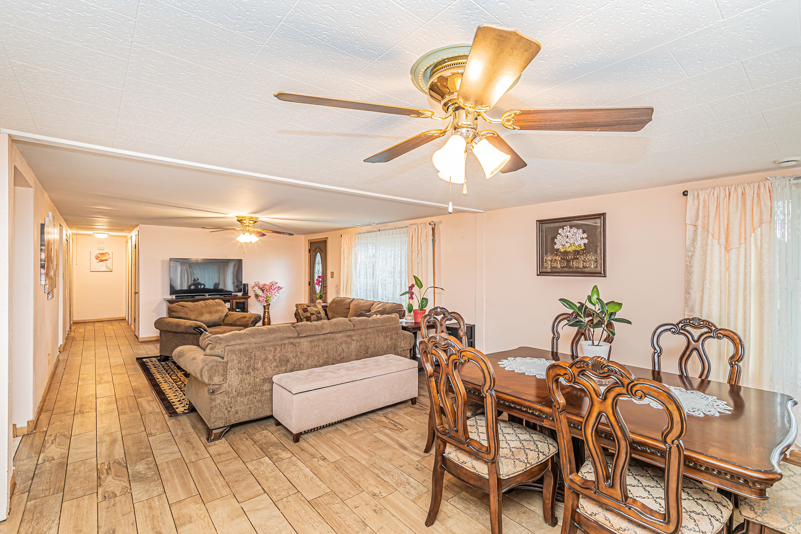 19264 Airport Road Romeoville, IL 60446 - Photo 6 of 27 a living room with furniture and a chandelier