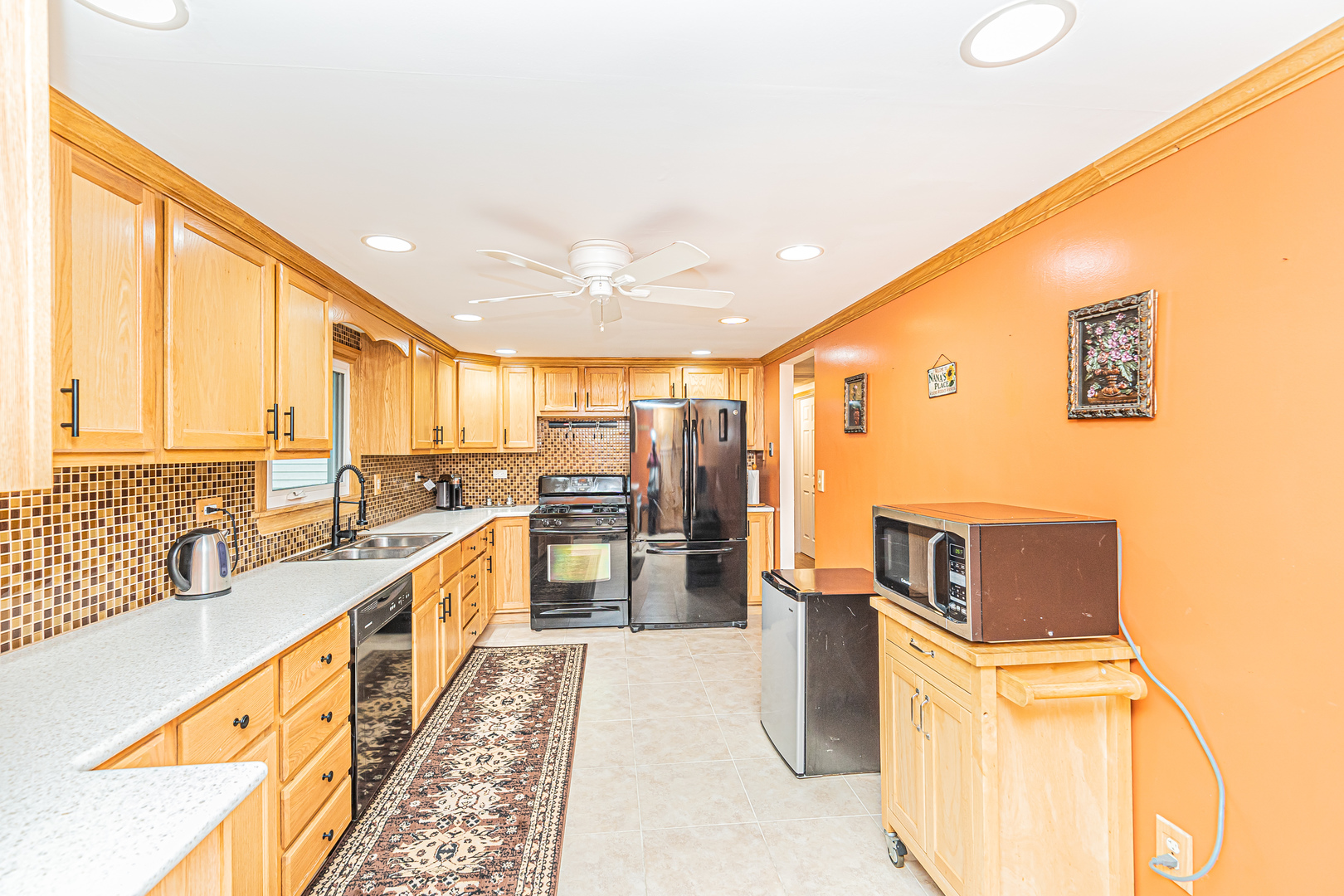 19264 Airport Road Romeoville, IL 60446 - Photo 7 of 27 a kitchen with stainless steel appliances granite countertop a refrigerator and a stove top oven