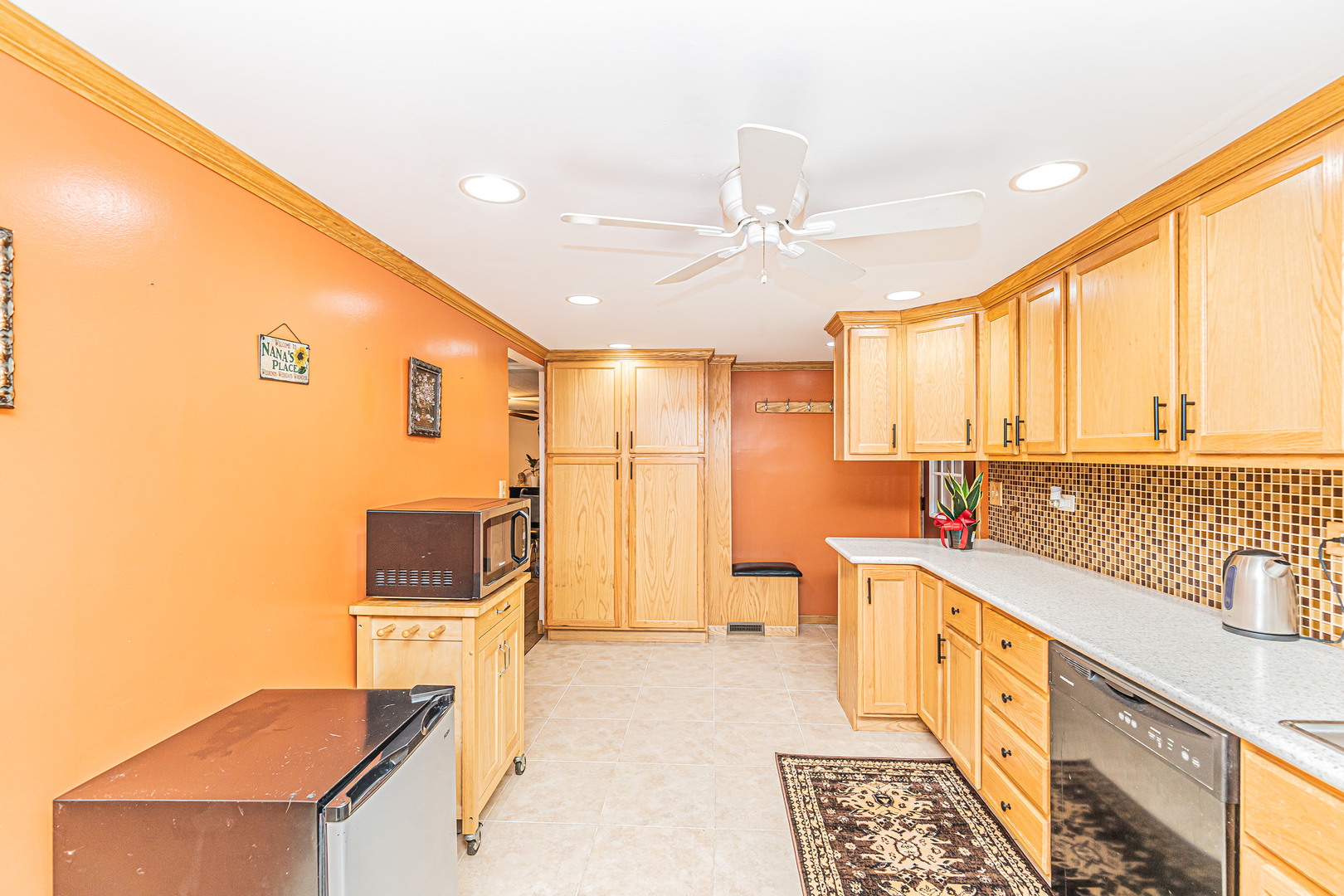 19264 Airport Road Romeoville, IL 60446 - Photo 8 of 27 a open kitchen with stainless steel appliances granite countertop a sink and cabinets