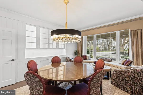 a view of a house with a swimming pool and a yard