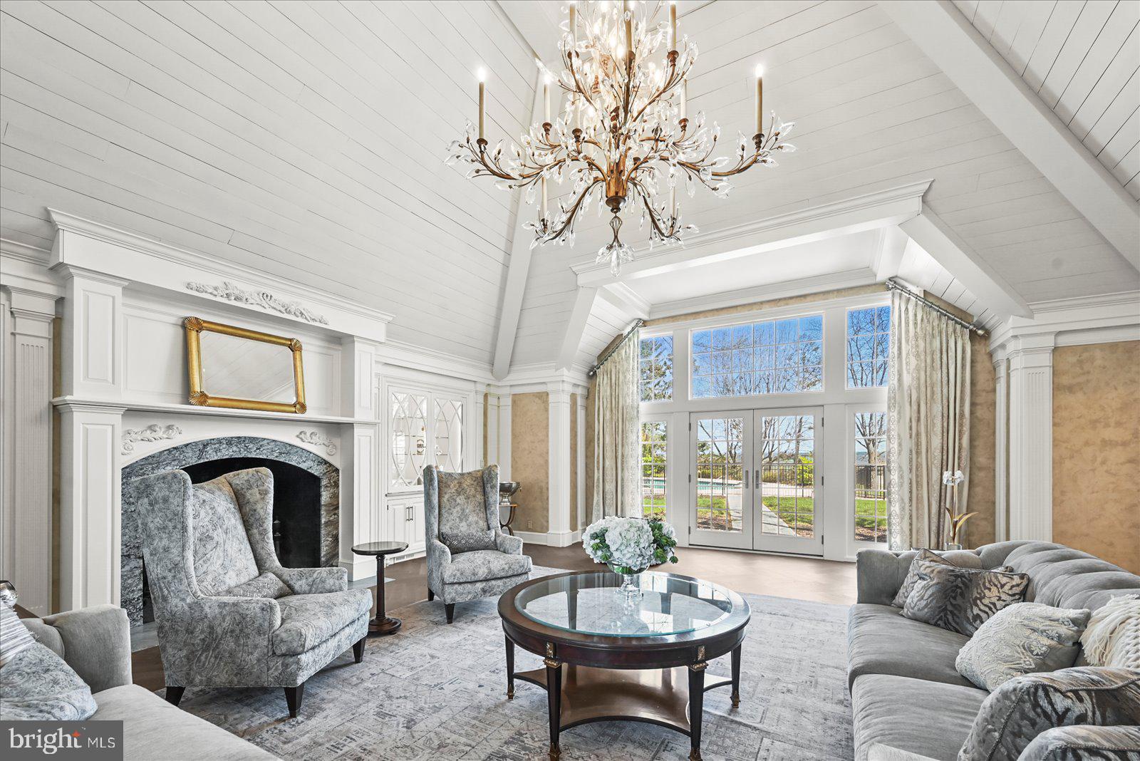 6759 Moulstown Road Hanover, PA 17331 - Photo 36 of 111 a living room with furniture a fireplace and a chandelier