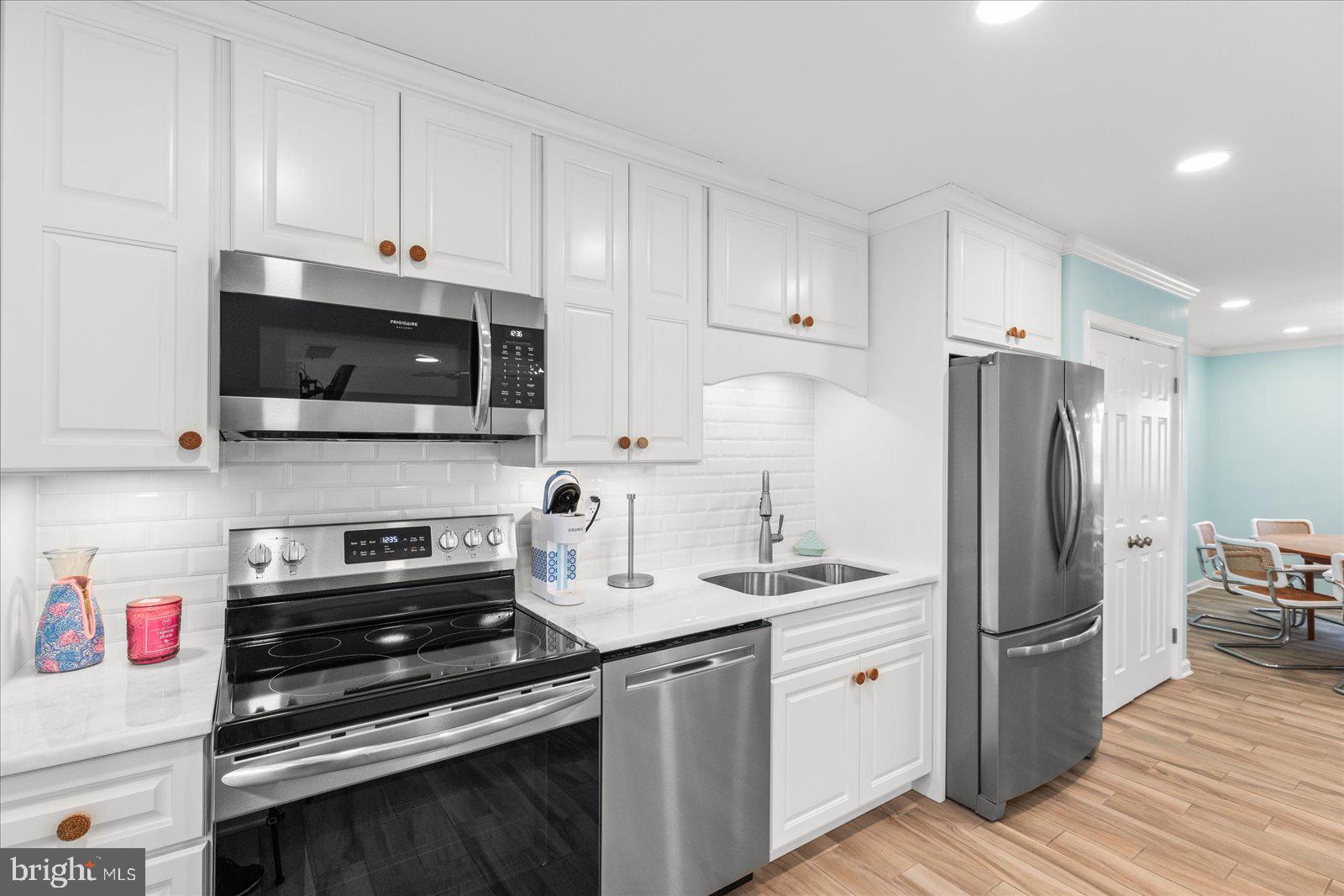 6759 Moulstown Road Hanover, PA 17331 - Photo 85 of 111 a kitchen with stainless steel appliances a refrigerator stove and white cabinets