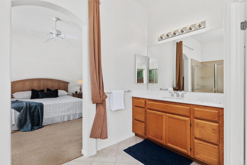 2330 Longfellow Road Carlsbad, CA 92008 - Photo 21 of 30 a en suite bathroom with a double vanity sink and a mirror