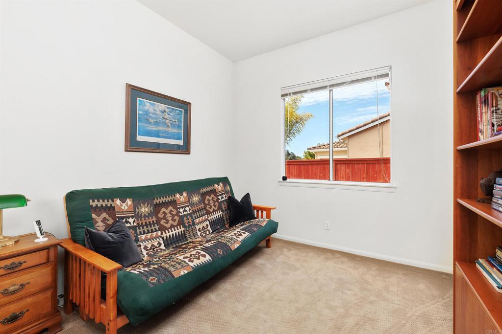 2330 Longfellow Road Carlsbad, CA 92008 - Photo 23 of 30 a bed sitting in a bedroom next to a window